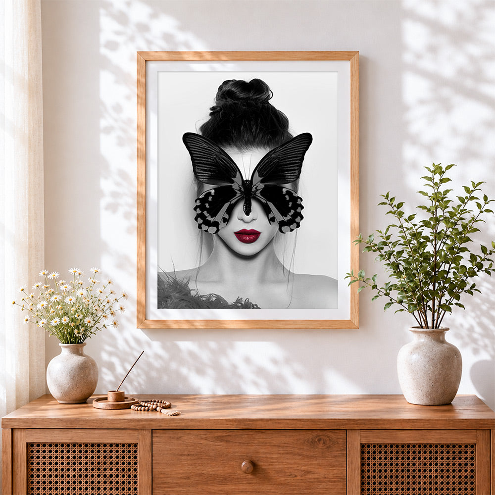Finished black butterfly blindfold portrait cross stitch artwork displayed