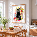 Black cat among flowers cross stitch artwork displayed on wall as home decor
