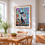 Black cat and flowers cross stitch artwork displayed on wall as home decor