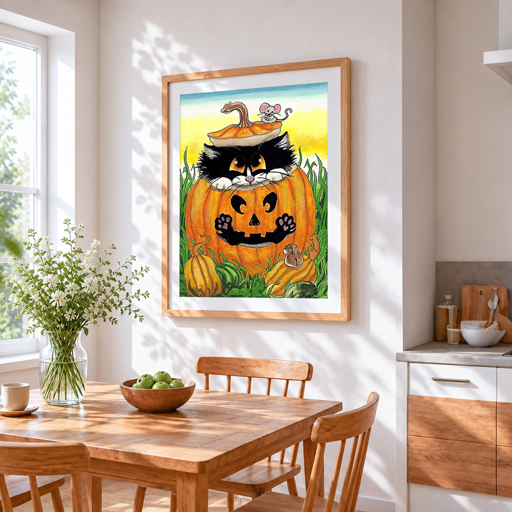 Black cat and mouse in pumpkin cross stitch artwork displayed on wall as home decor