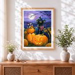 Finished black cat and mouse with candy corn cross stitch artwork displayed