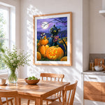 Black cat and mouse with candy corn cross stitch artwork displayed on wall as home decor