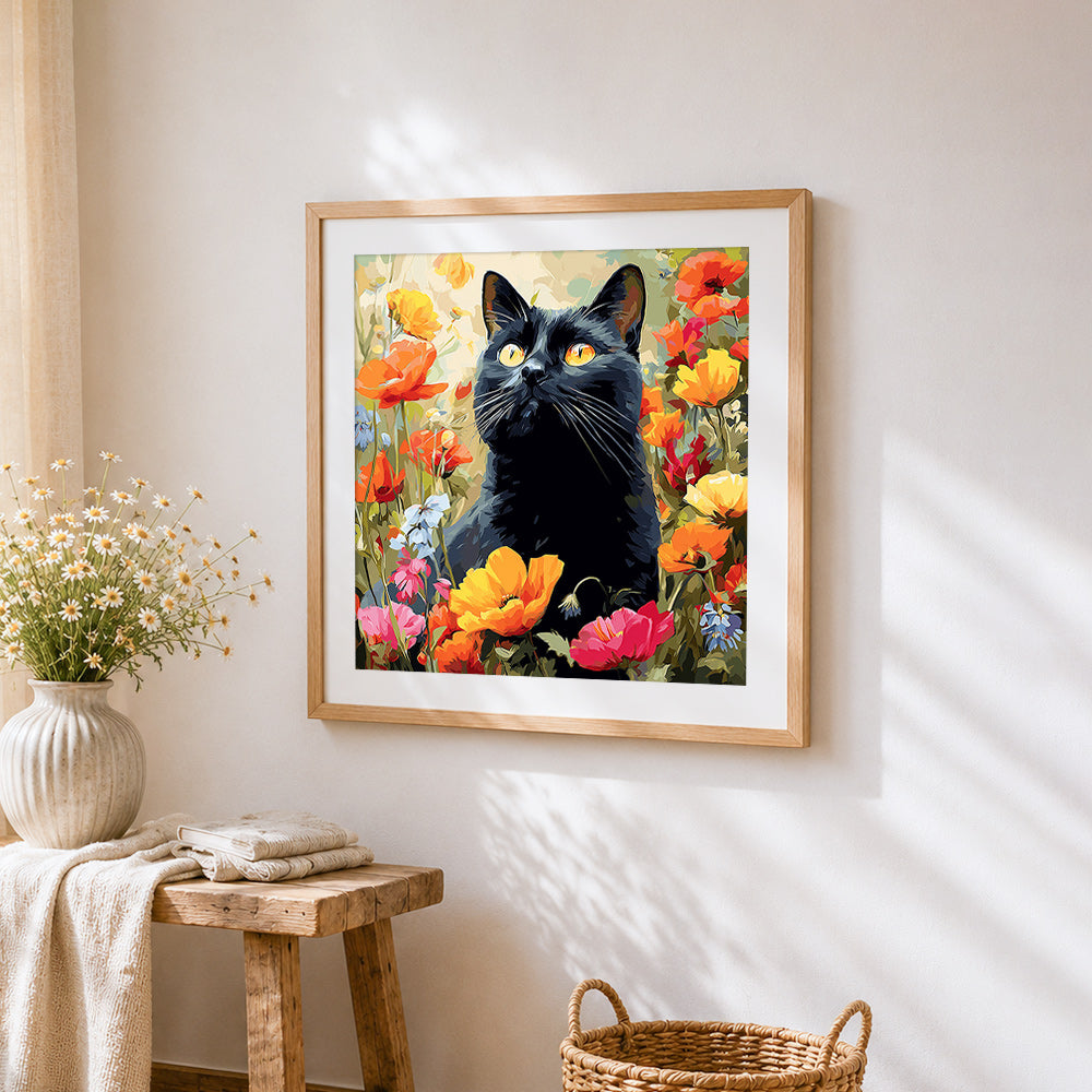 Black cat in a poppy field cross stitch artwork displayed on wall as home decor