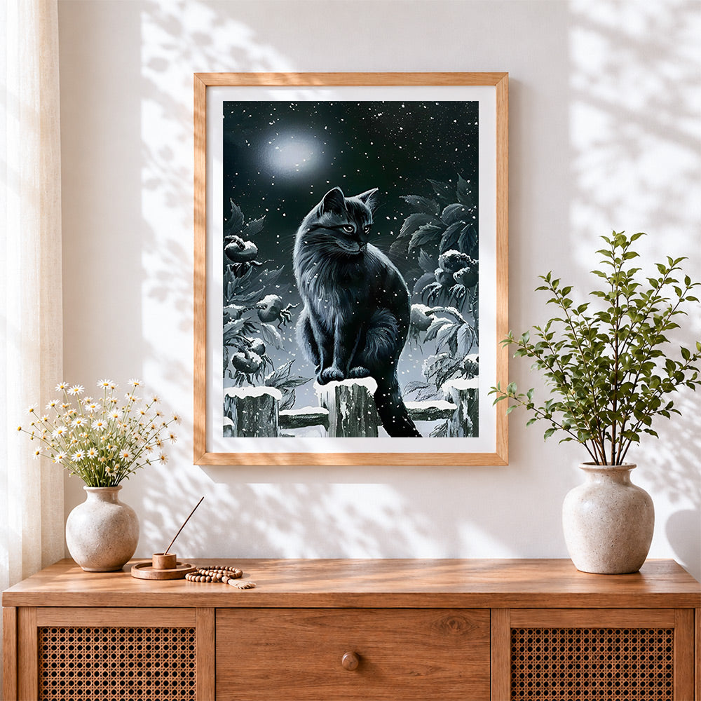 Finished black cat in snowy night cross stitch artwork displayed