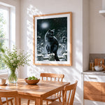 Black cat in snowy night cross stitch artwork displayed on wall as home decor