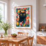 Black cat in wildflower garden cross stitch artwork displayed on wall as home decor