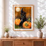 Finished black cat in witch hat with pumpkins cross stitch artwork displayed
