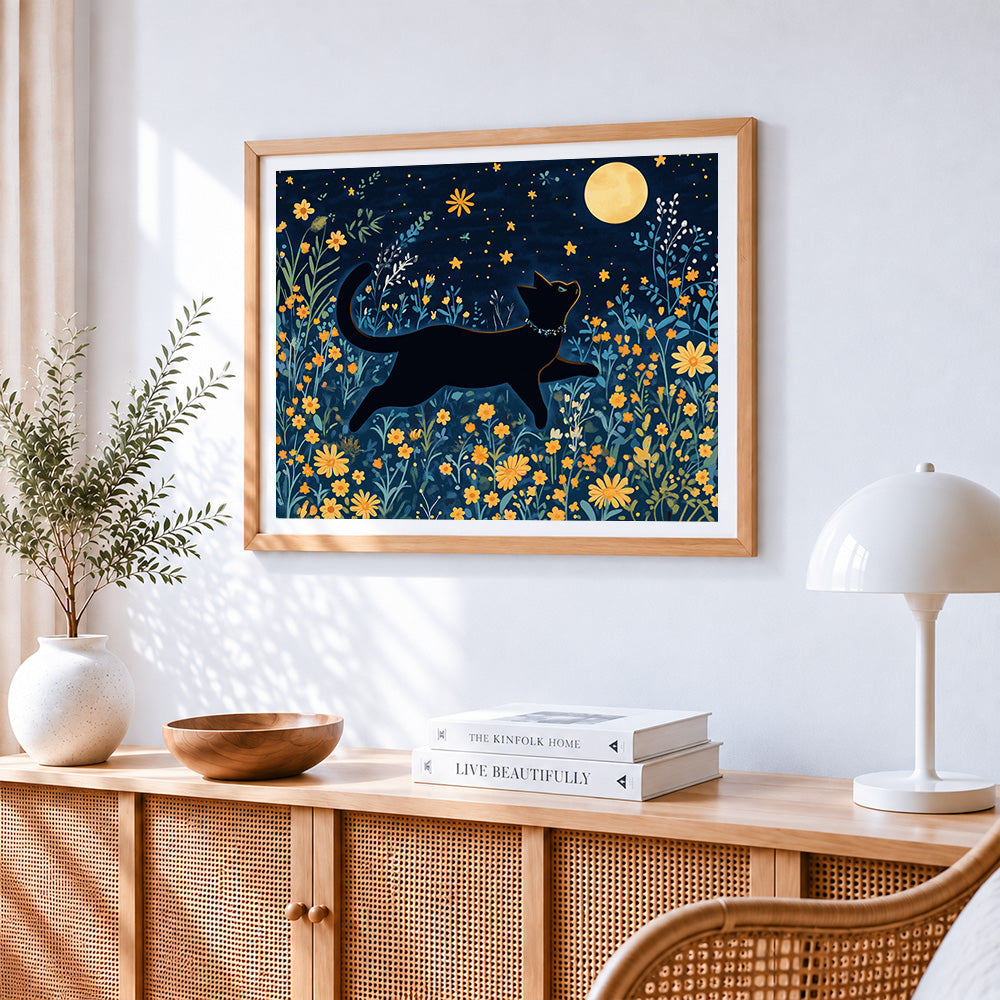 Black cat jumping under the moon cross stitch artwork displayed on wall as home decor