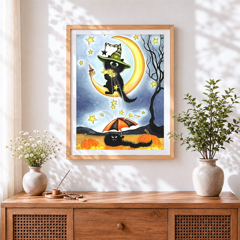 Finished black cat on crescent moon cross stitch artwork displayed