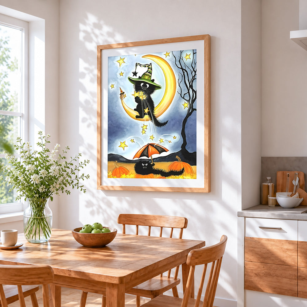 Black cat on crescent moon cross stitch artwork displayed on wall as home decor