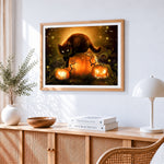 Black cat on glowing pumpkins cross stitch artwork displayed on wall as home decor