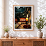 Finished black cat on magic books by candlelight cross stitch artwork displayed