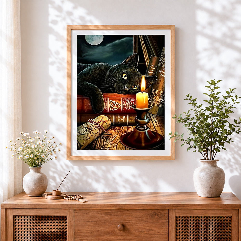 Finished black cat on magic books by candlelight cross stitch artwork displayed
