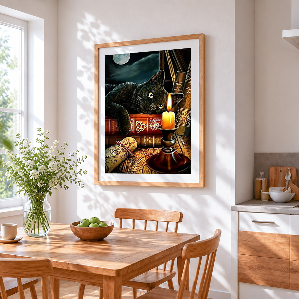 Black cat on magic books by candlelight cross stitch artwork displayed on wall as home decor