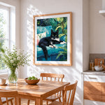 Black cat on teal sofa cross stitch artwork displayed on wall as home decor