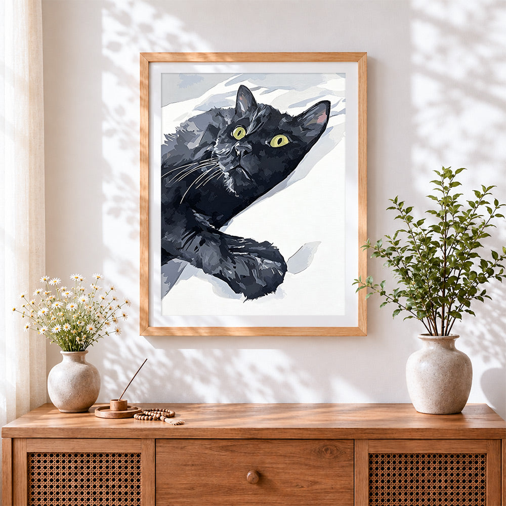 Finished black cat on white sheets cross stitch artwork displayed