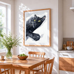 Black cat on white sheets cross stitch artwork displayed on wall as home decor