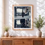 Finished black cat reflection cross stitch artwork displayed