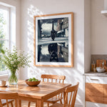 Black cat reflection cross stitch artwork displayed on wall as home decor