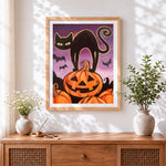 Finished black cat silhouette with pumpkins cross stitch artwork displayed