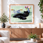 Finished black cat sitting in a green sink cross stitch artwork displayed