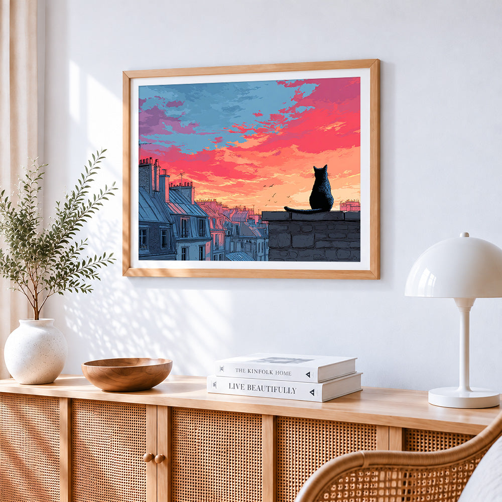 Black cat watching the sunset on a roof cross stitch artwork displayed on wall as home decor