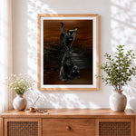 Finished black cat water reflection cross stitch artwork displayed