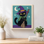 Finished black cat with broom artwork displayed on a wall