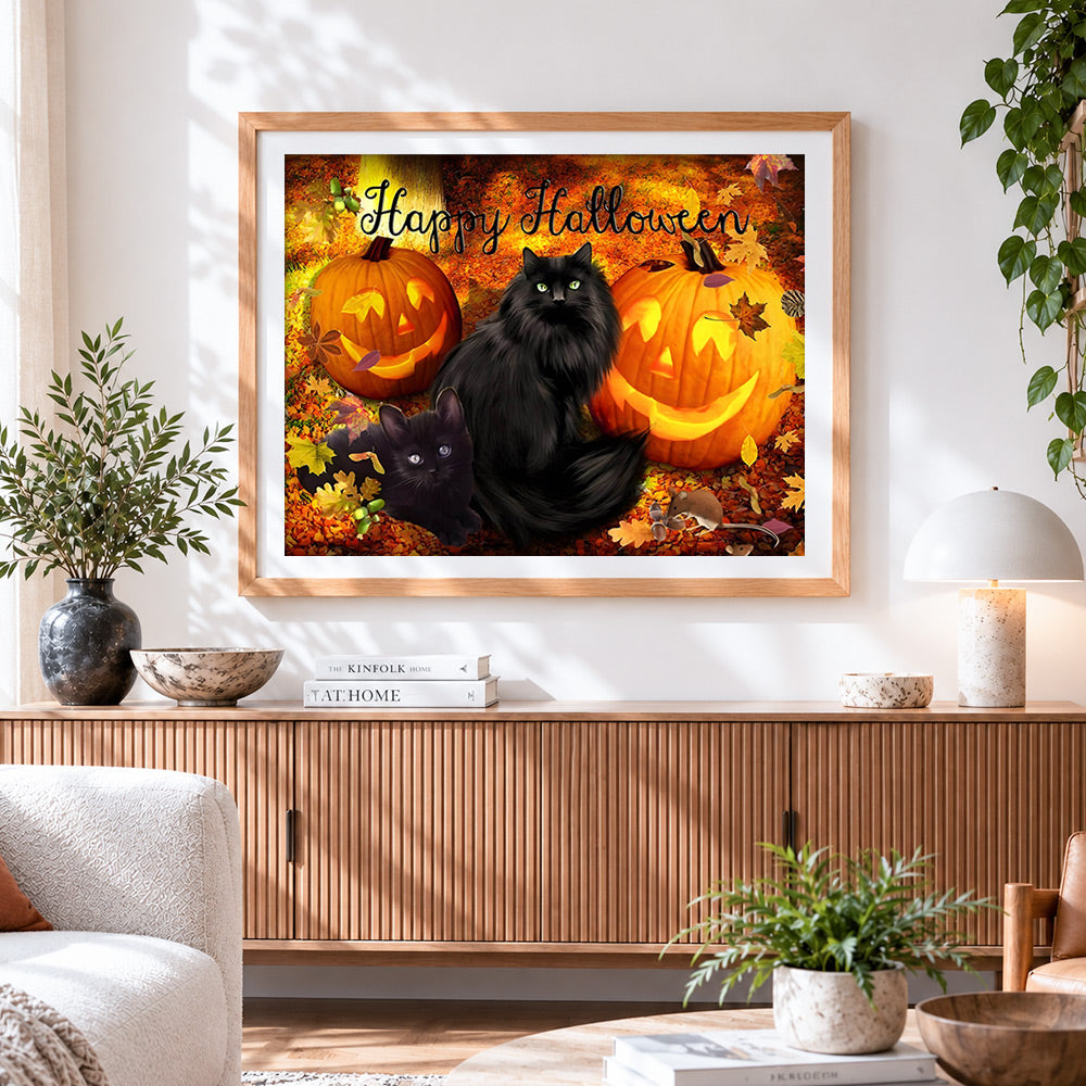 Finished black cats and jack-o'-lanterns in autumn leaves cross stitch artwork displayed