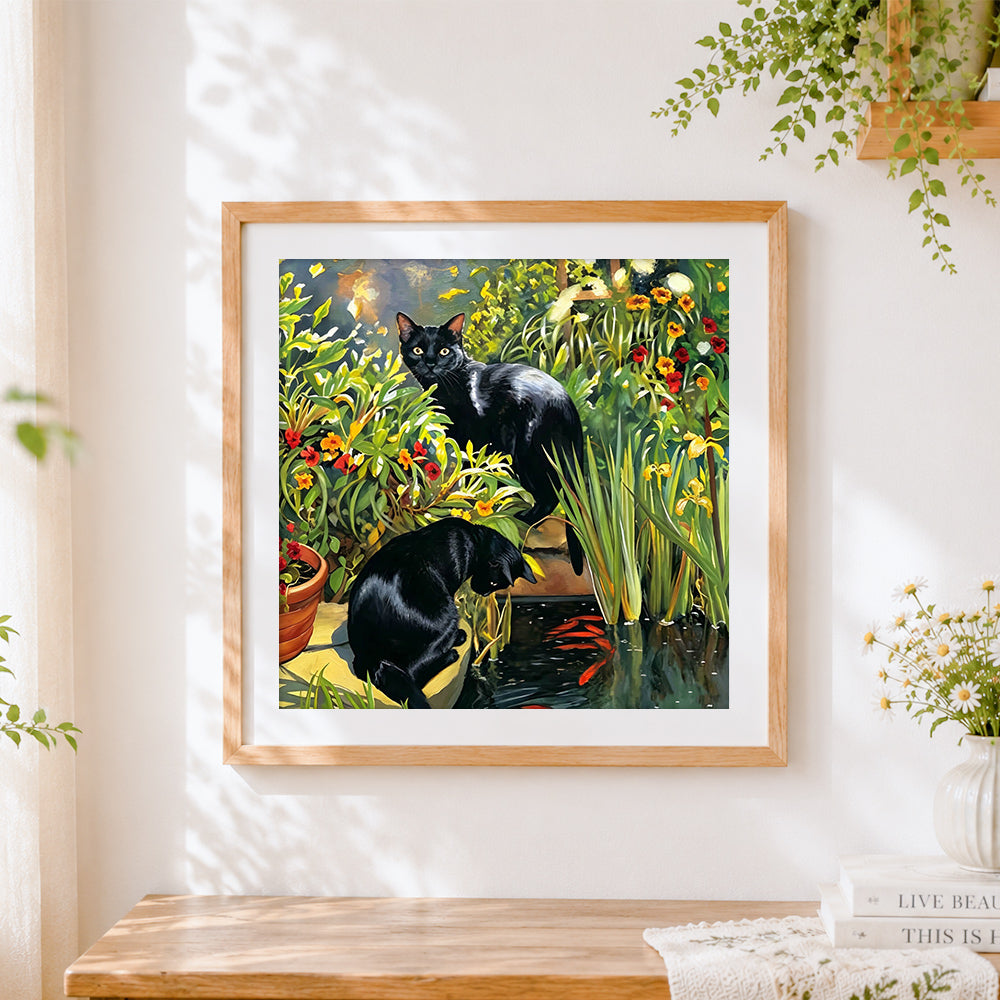 Finished black cats in garden with koi fish cross stitch artwork displayed