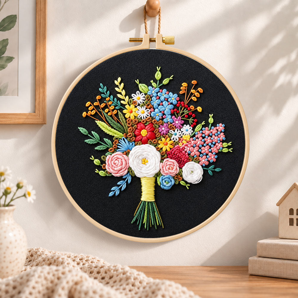 Black fabric flower bouquet embroidery hoop wall art displayed as warm and cosy handmade home decor