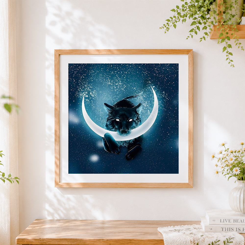 Finished black wolf and crescent moon cross stitch artwork displayed