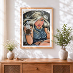 Finished blonde woman drinking coffee cross stitch artwork displayed