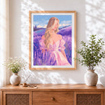 Finished blonde woman in lavender field cross stitch artwork displayed