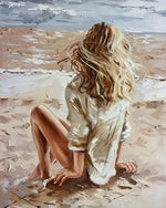 Blonde woman sitting on beach cross stitch kit for beginners