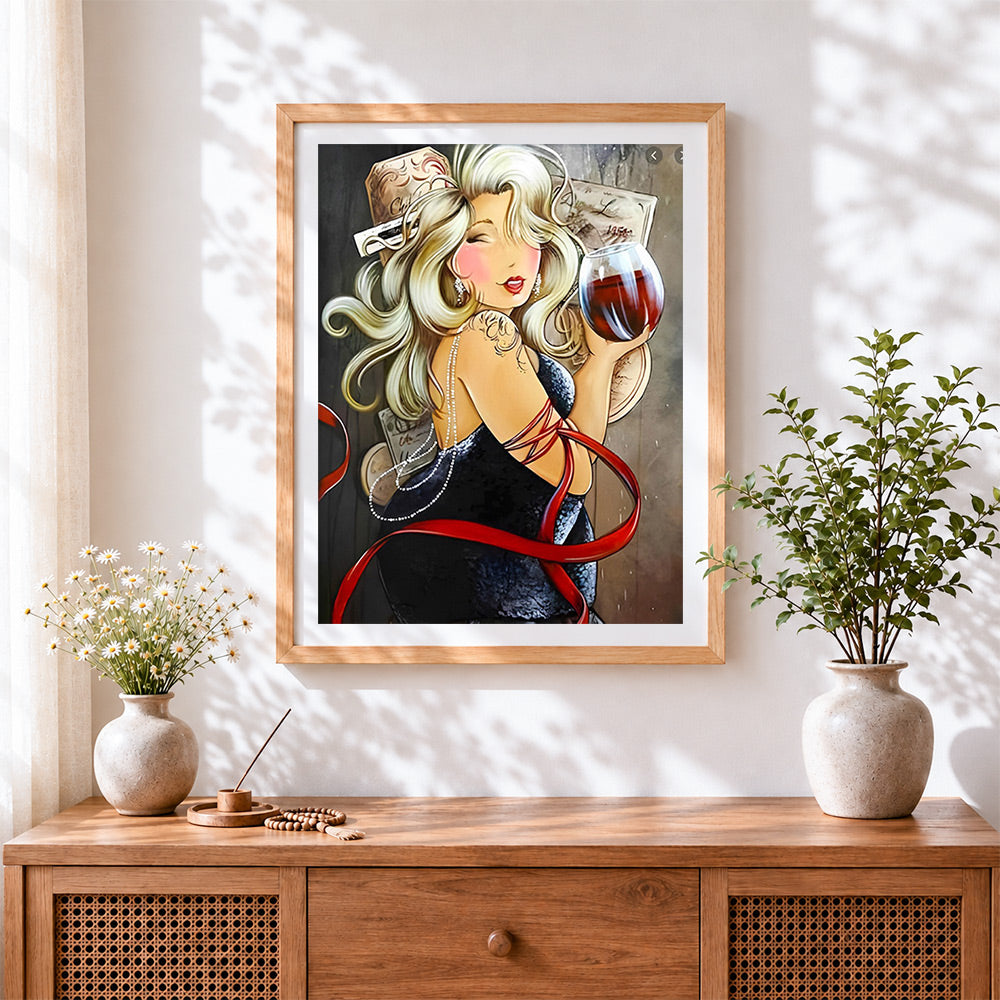 Finished blonde woman with glass of wine cross stitch artwork displayed