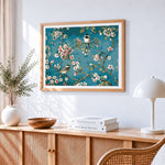 Blossoming cherry tree with birds cross stitch artwork displayed on wall as home decor