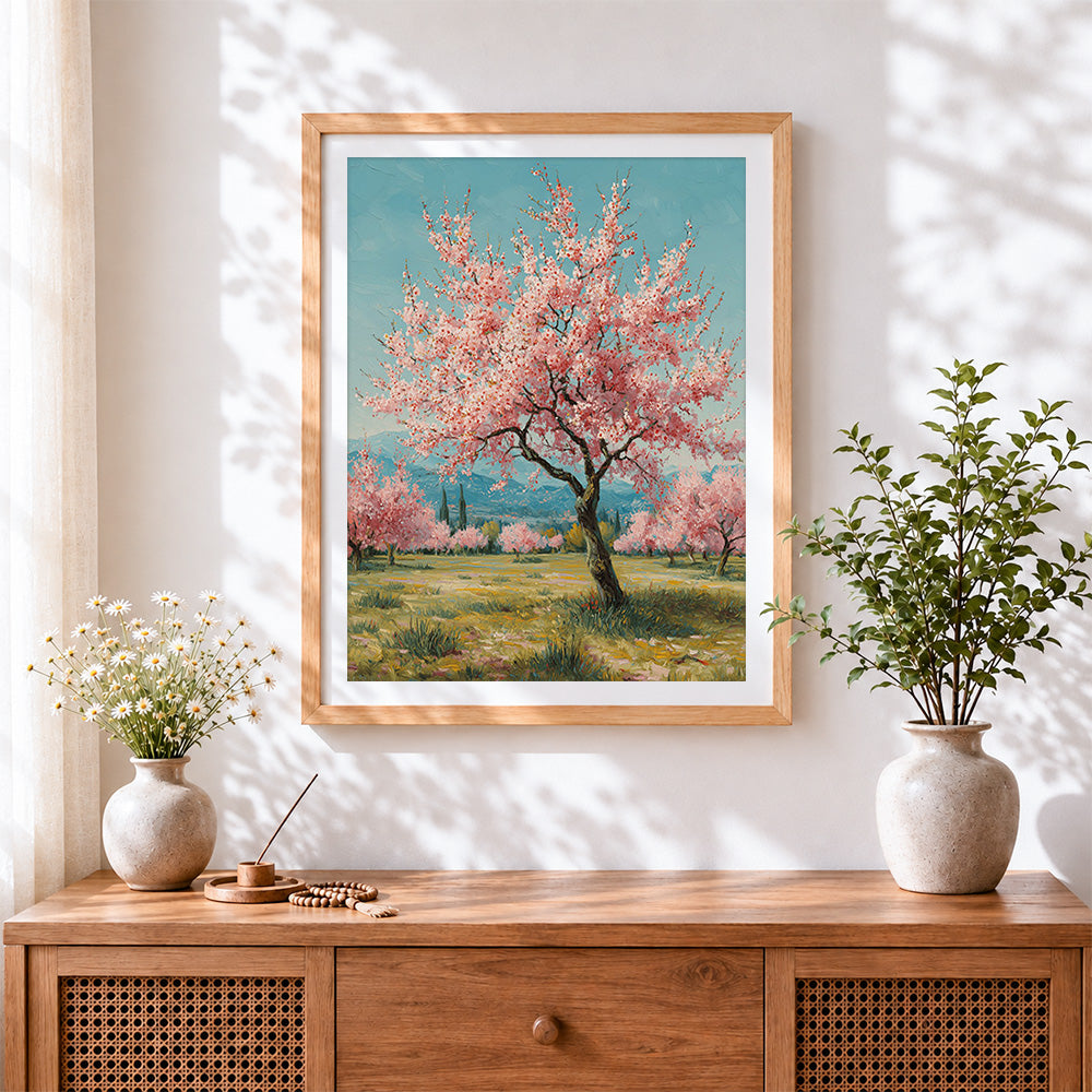 Finished blossoming pink trees in spring cross stitch artwork displayed