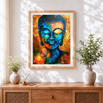 Finished blue and gold buddha cross stitch artwork displayed