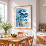 Blue and gold poppies cross stitch artwork displayed on wall as home decor