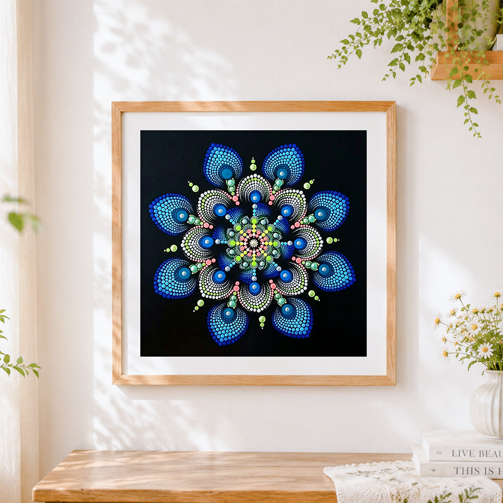 Finished blue and green dot mandala cross stitch artwork displayed