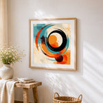 Blue and orange abstract swirls cross stitch artwork displayed on wall as home decor
