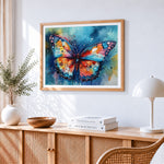 Blue and orange watercolour butterfly paint by numbers artwork displayed on wall as home decor