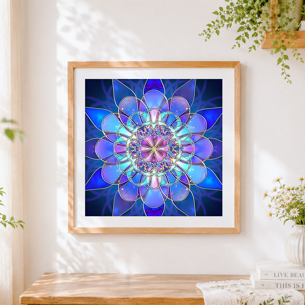 Finished blue and purple lotus mandala cross stitch artwork displayed