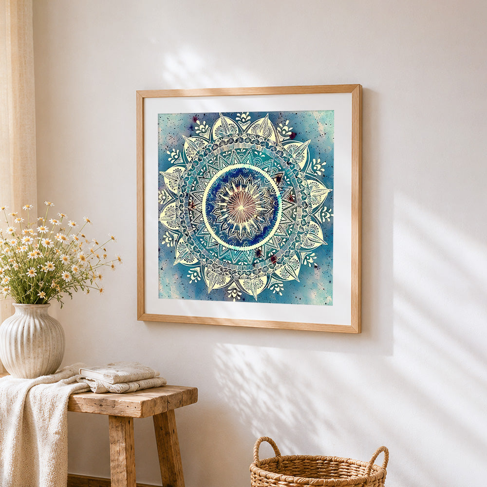 Blue and teal mandala cross stitch artwork displayed on wall as home decor