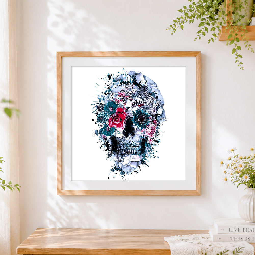 Finished blue and white watercolour floral skull cross stitch artwork displayed