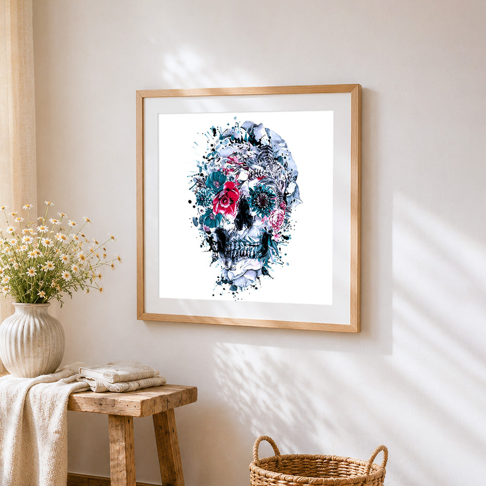 Blue and white watercolour floral skull cross stitch artwork displayed on wall as home decor