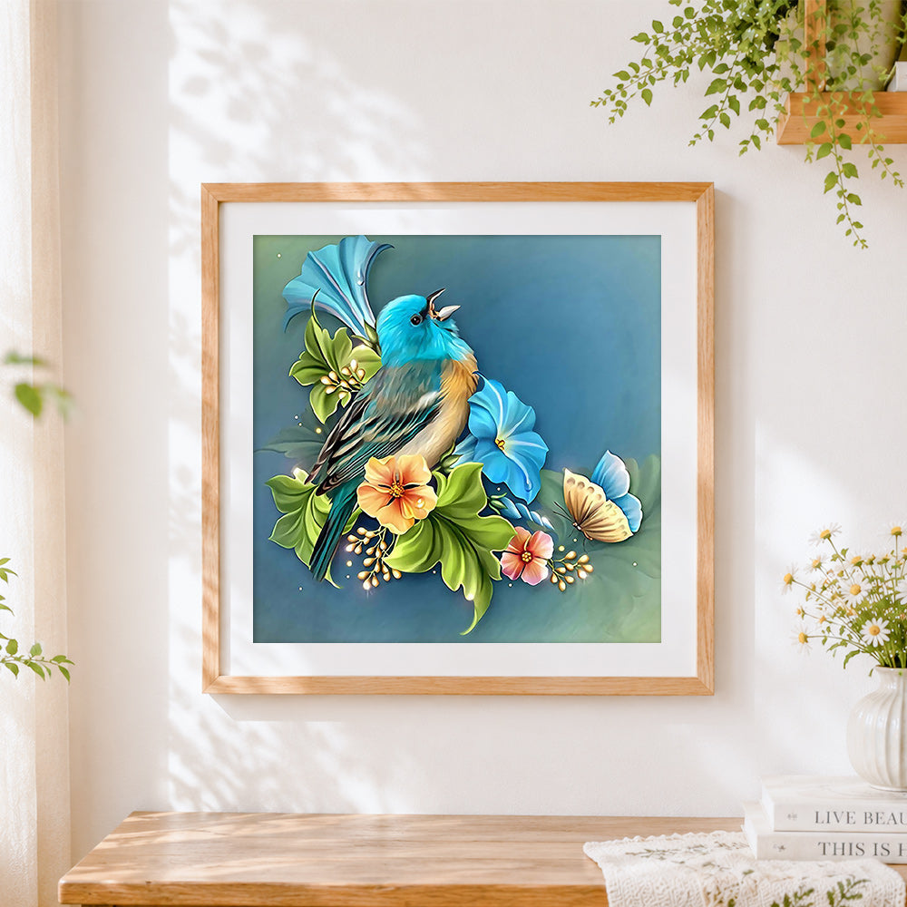 Finished blue bird with flowers cross stitch artwork displayed