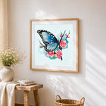 Blue butterfly with cherry blossoms cross stitch artwork displayed on wall as home decor