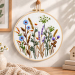 Blue cornflower meadow embroidery hoop wall art displayed as warm and cosy handmade home decor